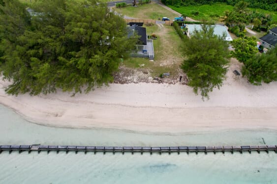 Aerial View of Maurua Beach House with lagoon